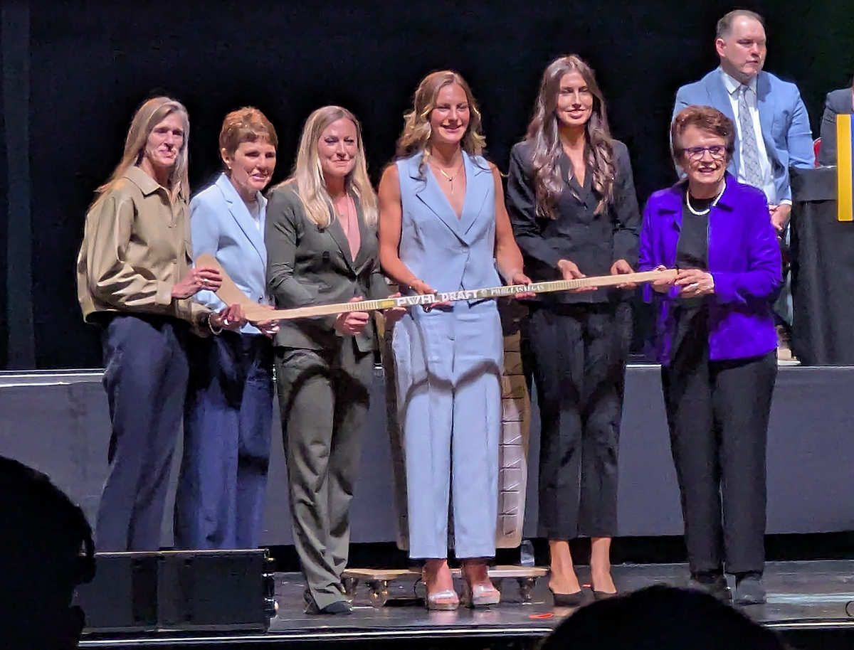 Lacey Eden is selected fifth overall at the 2026 PWHL Entry Draft, flanked by PWHL Las Vegas general manager Dominique Didia and members of the PWHL leadership team.