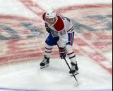 Lane Hutson of the Montreal Canadiens gets set for a faceoff during a game against the Detroit Red Wings.