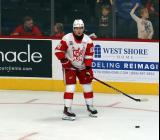 Jakub Rychlovsky of the Grand Rapids Griffins skates near the boards during pre-game warmups before a game against the Manitoba Moose.