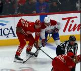 Elmer Soderblom of the Detroit Red Wings lines up at wing for a faceoff opposite Patrik Laine of the Montreal Canadiens.