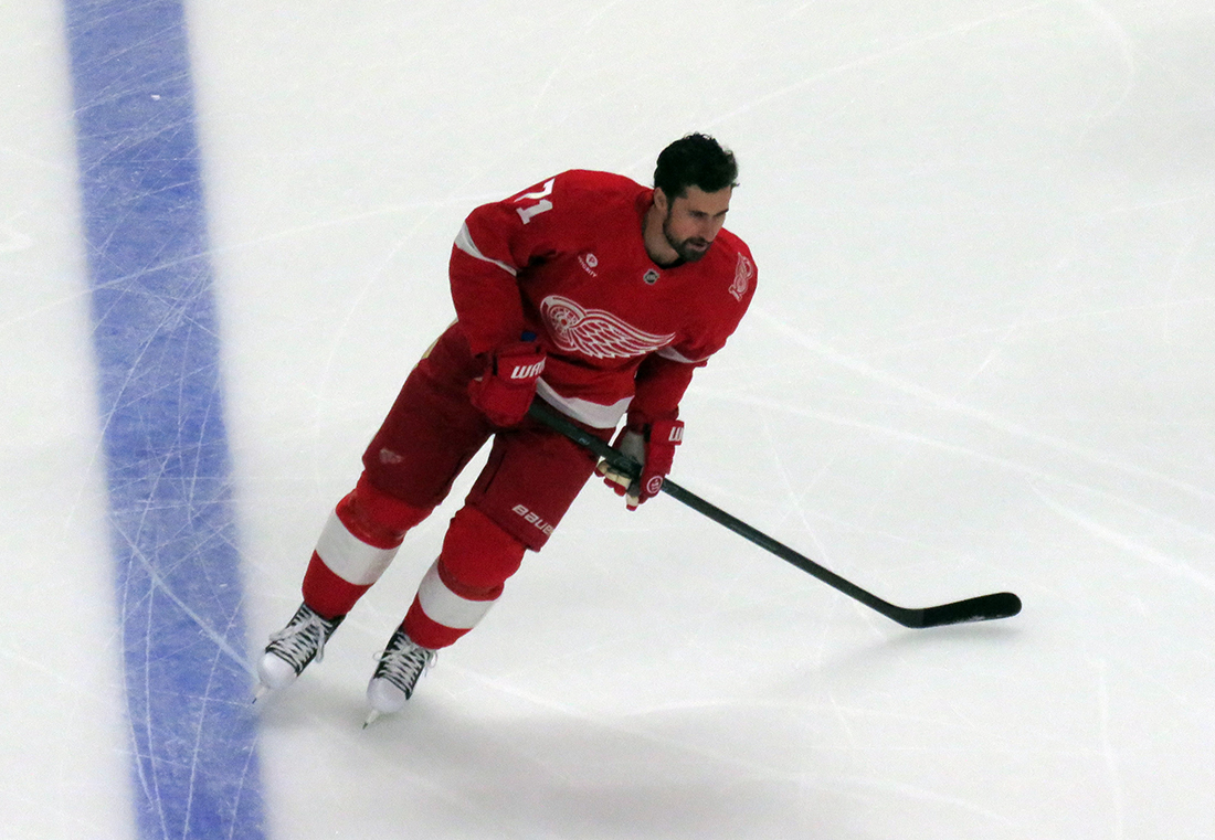 Dylan Larkin of the Detroit Red Wings skates during pre-game warmups before a game against the Carolina Hurricanes, wearing a customized Sergei Fedorov jersey and white skates in honor of Fedorov's jersey retirement.