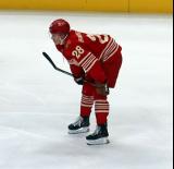 Michael Brandsegg-Nygard of the Detroit Red Wings crouches near the boards during pre-game warmups before a game against the Montreal Canadiens.