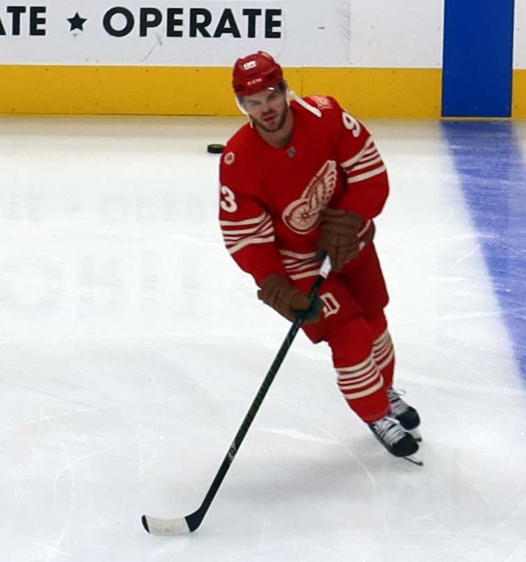 Alex DeBrincat of the Detroit Red Wings skates near the blue line during pre-game warmups before a game against the Montreal Canadiens.