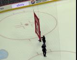 Workers remove Sergei Fedorov's retired number banner from the Little Caesars Arena rafters after Fedorov's jersey retirement game.