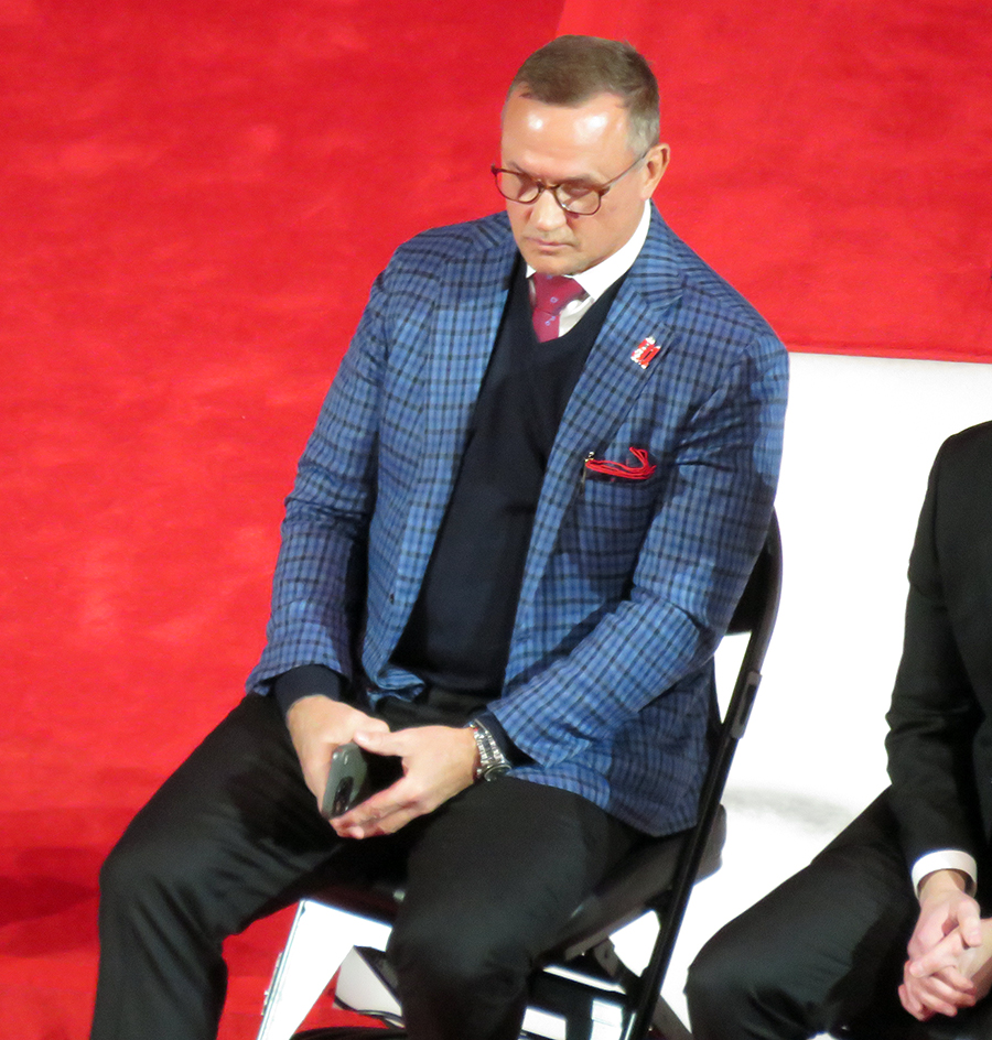 Steve Yzerman watches Sergei Fedorov speak during Fedorov's jersey retirement ceremony.