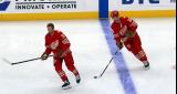 J.T. Compher and Mason Appleton of the Detroit Red Wings skate at the blue line during pre-game warmups before a game against the Montreal Canadiens.