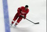 Dylan Larkin of the Detroit Red Wings skates during pre-game warmups before a game against the Carolina Hurricanes, wearing a customized Sergei Fedorov jersey and white skates in honor of Fedorov's jersey retirement.