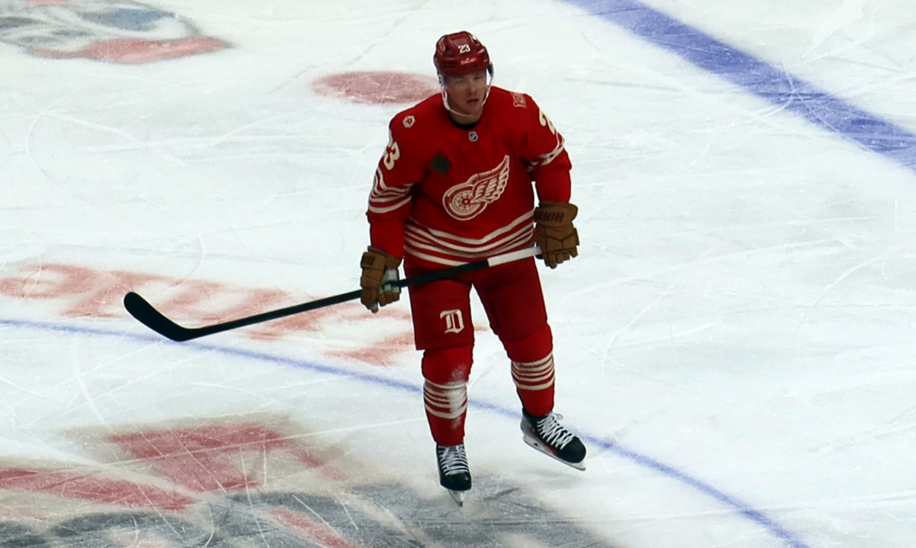 Lucas Raymond of the Detroit Red Wings skates at center ice during a game against the Montreal Canadiens.
