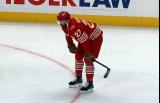 Michael Rasmussen of the Detroit Red Wings crouches near the boards during pre-game warmups before a game against the Montreal Canadiens.