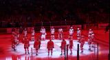 The Grand Rapids Griffins salute their fans from center ice at the end of player introductions before the team's home opener against the Manitoba Moose.