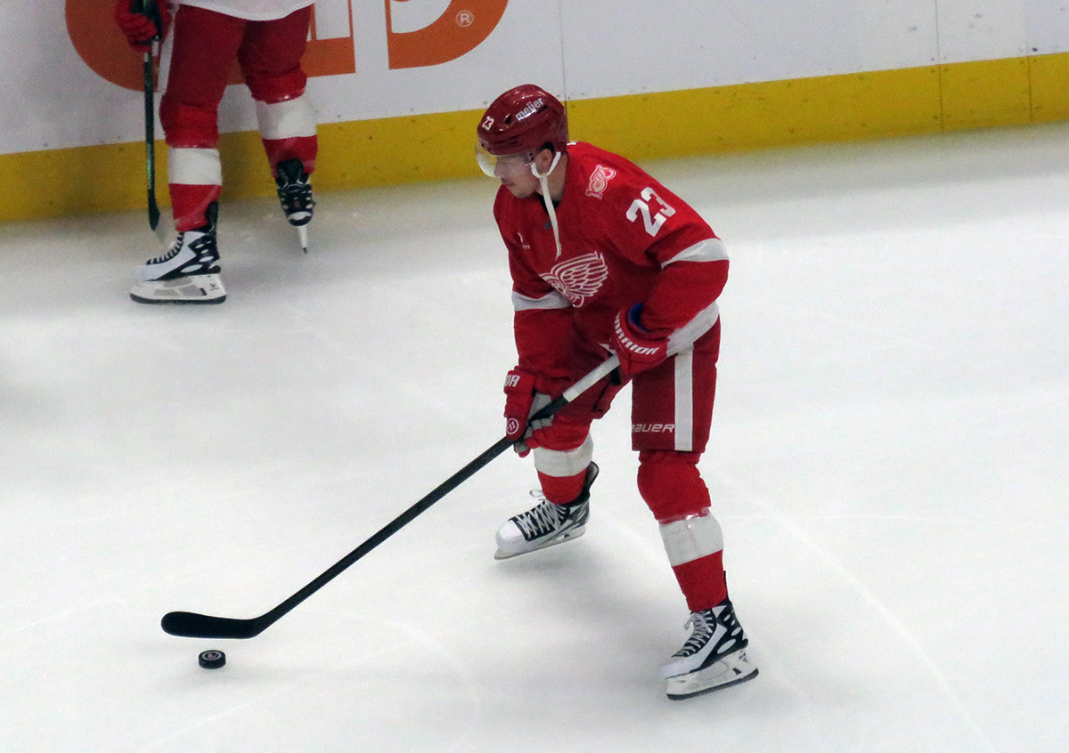 Lucas Raymond of the Detroit Red Wings skates during pre-game warmups before a game against the Carolina Hurricanes, wearing a customized Sergei Fedorov jersey and white skates in honor of Fedorov's jersey retirement.