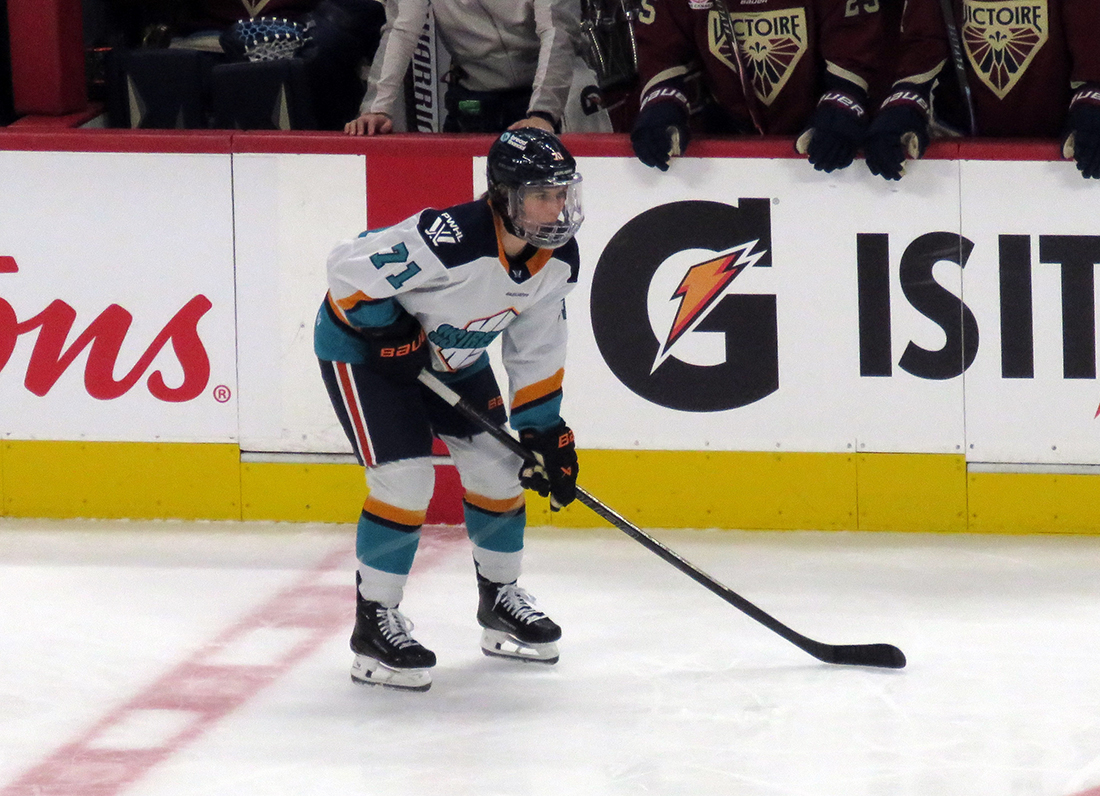 Jincy Roese of the New York Sirens gets set for a faceoff during the PWHL Takeover Tour Detroit game against the Montreal Victoire.