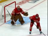John Gibson and Simon Edvinsson of the Detroit Red Wings get set for a faceoff during a game against the Montreal Canadiens.