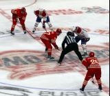 The Detroit Red Wings and Montreal Canadiens line up for a faceoff, with J.T. Compher, Andrew Copp, and Michael Brandsegg-Nygard of Detroit opposite Alex Newhook and Ivan Demidov of Montreal.