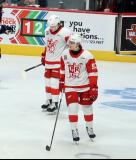 Tyler Angle and Amadeus Lombardi of the Grand Rapids Griffins skate away from the bench during a stop in play in a game against the Manitoba Moose.