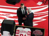 Sergei Fedorov and Mickey Redmond shake hands at Fedorov's jersey retirement ceremony.