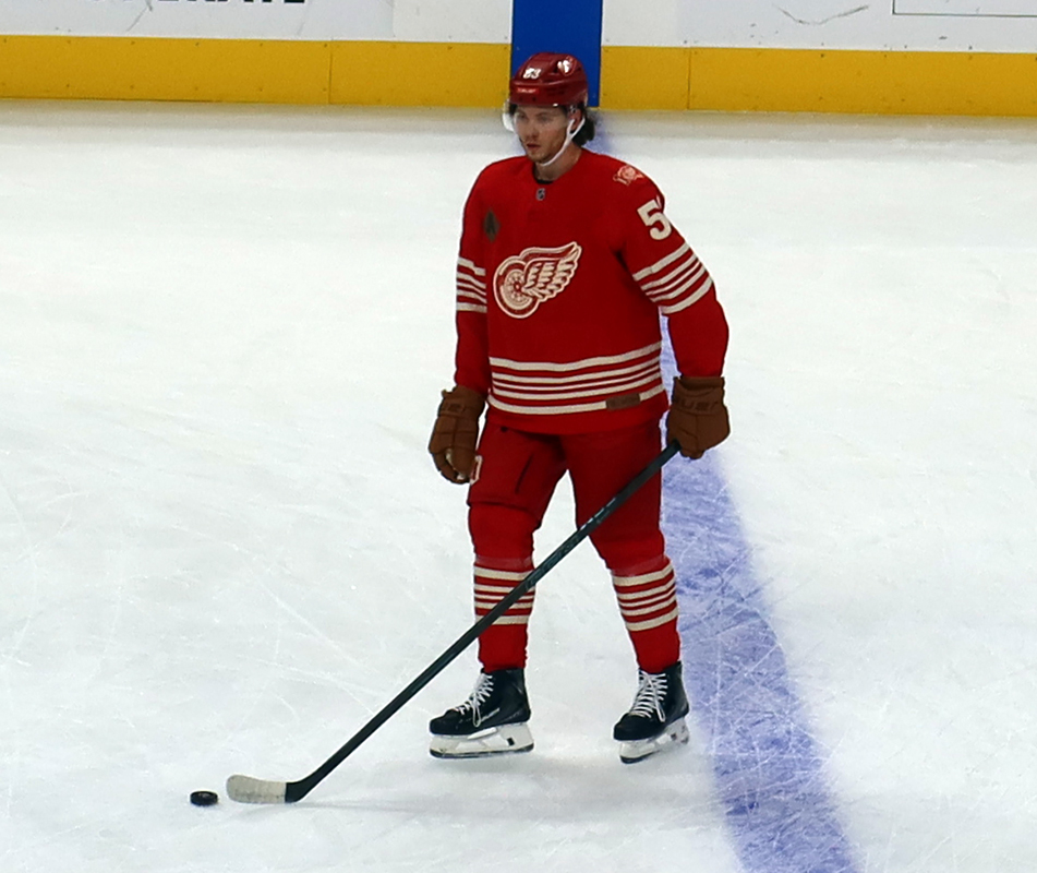 Moritz Seider of the Detroit Red Wings stands at the blue line during pre-game warmups before a game against the Montreal Canadiens.