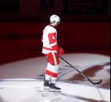 Antti Tuomisto of the Grand Rapids Griffins skates out during player introductions before the team's home opener against the Manitoba Moose.